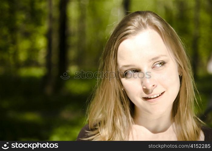 Happy Spring Time. Woman Smiling In The Forest.