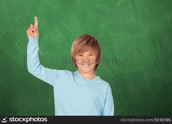 Happy student asking to speak with a green blackboard of background