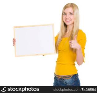 Happy student girl showing blank board and thumbs up