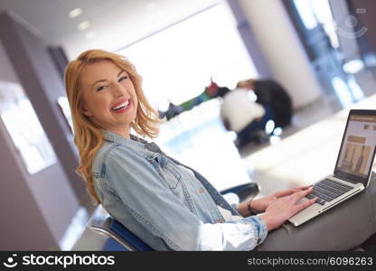 happy student girl working on laptop computer at modern school university indoors