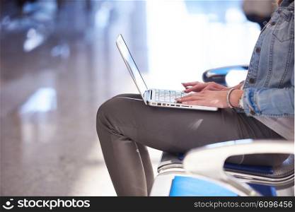 happy student girl working on laptop computer at modern school university indoors