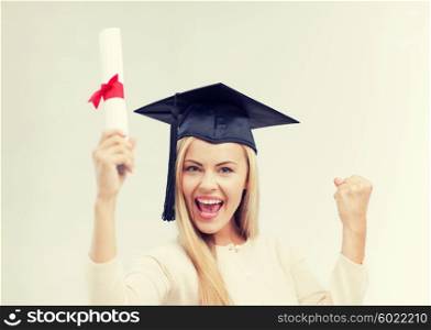 happy student in graduation cap with certificate. student in graduation cap with certificate