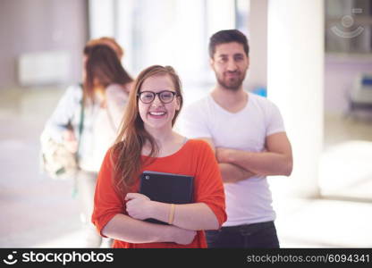 happy students couple standing together at university campus interior