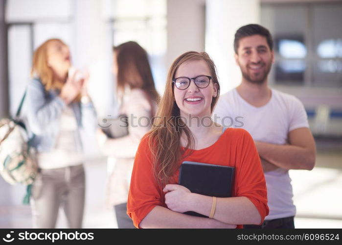 happy students couple standing together at university campus interior