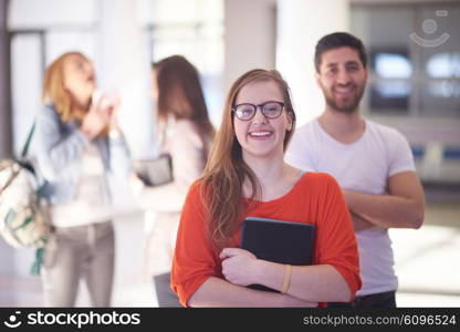 happy students couple standing together at university campus interior