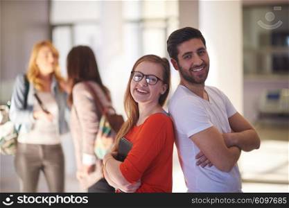 happy students couple standing together at university campus interior