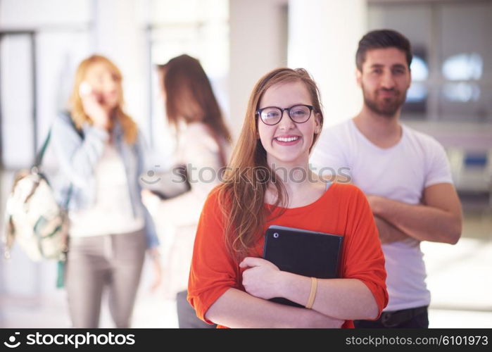 happy students couple standing together at university campus interior