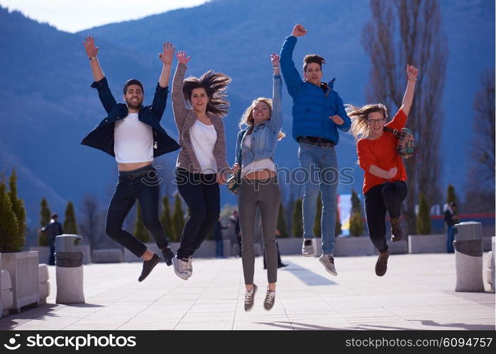 happy students group have fun outdoor in university campus park