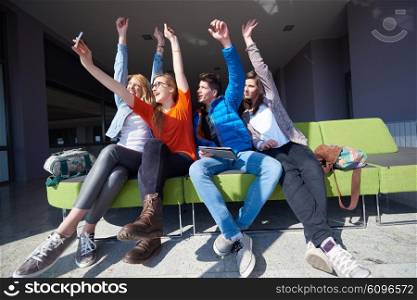 happy students group taking selfie with smartphone and tablet computer