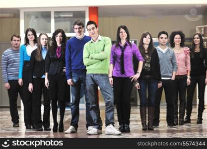 happy students people group portrait at university indoor building