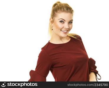 Happy stylish woman wearing top with long sleeve decorated by massive flounces. Fashion, clothing style concept.. Stylish woman wearing burgundy top