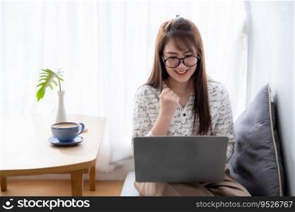 Happy successful business of asian freelance people business female expressed confidence embolden working with laptop computer with coffee cup and smartphone in coffee shop ,communication concept