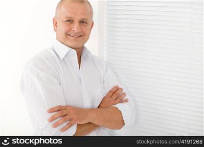Happy successful mature businessman professional portrait smiling crossed arms