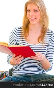 Happy teen girl reading book isolated on white &#xA;