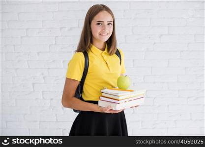 happy teen girl with books