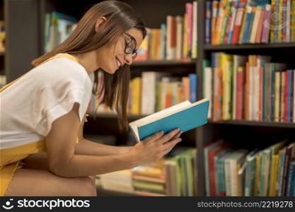 happy teen schoolgirl enjoying book