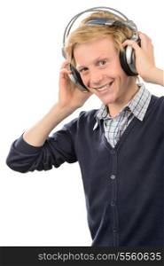 Happy teenage boy listening music while standing over white background