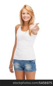 happy teenage girl in blank white t-shirt showing greeting gesture