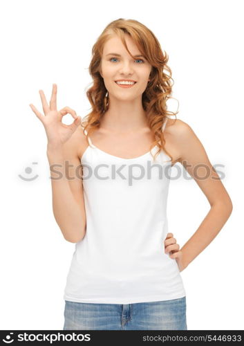 happy teenage girl in blank white t-shirt showing ok sign