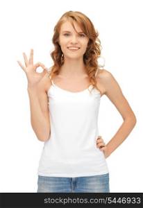 happy teenage girl in blank white t-shirt showing ok sign