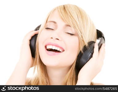 happy teenage girl in headphones over white