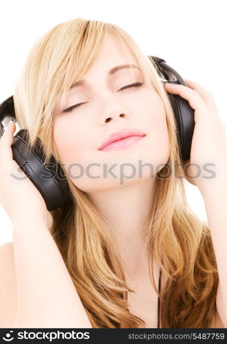 happy teenage girl in headphones over white