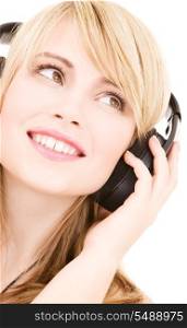 happy teenage girl in headphones over white