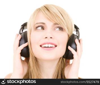 happy teenage girl in headphones over white