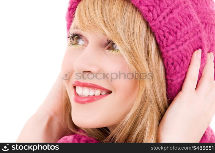 happy teenage girl in winter hat over white