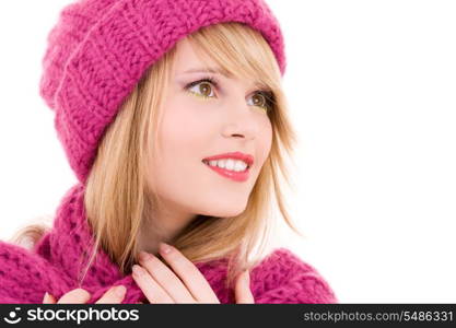 happy teenage girl in winter hat over white