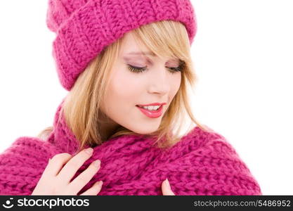 happy teenage girl in winter hat over white