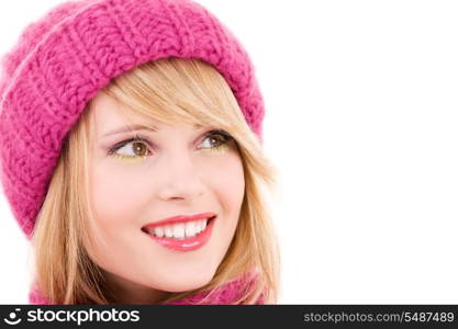 happy teenage girl in winter hat over white