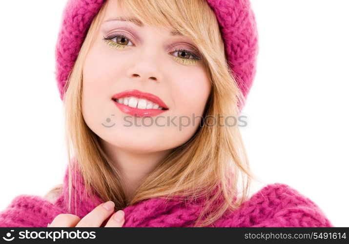 happy teenage girl in winter hat over white