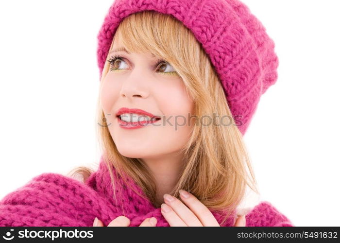 happy teenage girl in winter hat over white