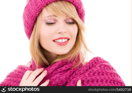 happy teenage girl in winter hat over white