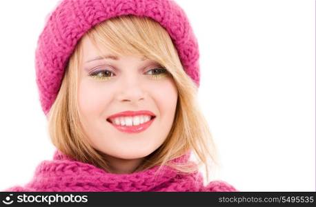 happy teenage girl in winter hat over white