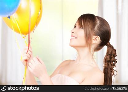 happy teenage girl with balloons at home