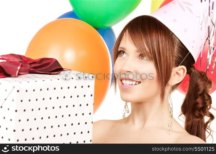 happy teenage party girl with balloons and gift box