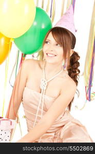 happy teenage party girl with balloons and gift box