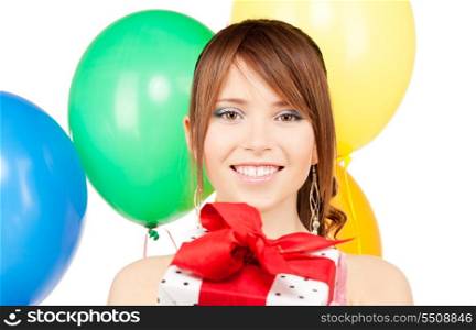 happy teenage party girl with balloons and gift box