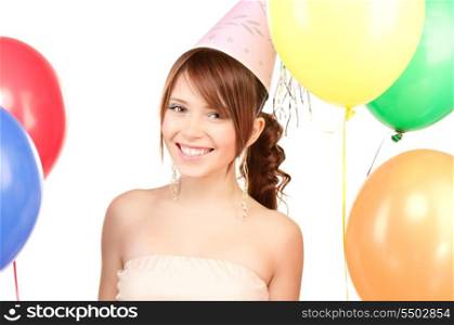 happy teenage party girl with balloons over white