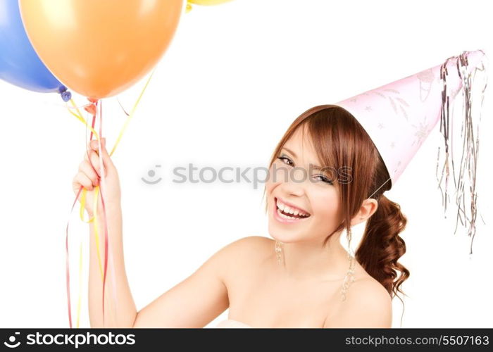 happy teenage party girl with balloons over white