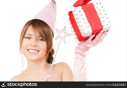 happy teenage party girl with magic wand and gift box