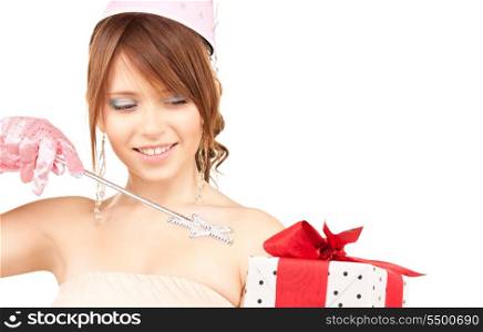 happy teenage party girl with magic wand and gift box