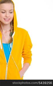Happy teenager girl in earphones looking on copy space