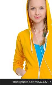 Happy teenager girl listening music in earphones