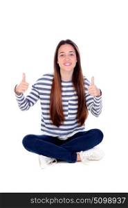 Happy teenager girl saying Ok with her thumbs up isolated on a white background