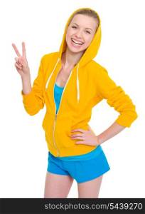 Happy teenager girl showing victory gesture