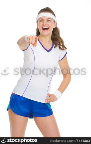 Happy tennis player pointing in camera