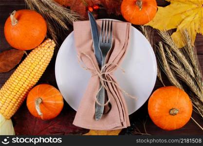Happy Thanksgiving Day. Festive table setting on a brown wooden background.. Happy Thanksgiving Day. Festive table setting on brown wooden background.